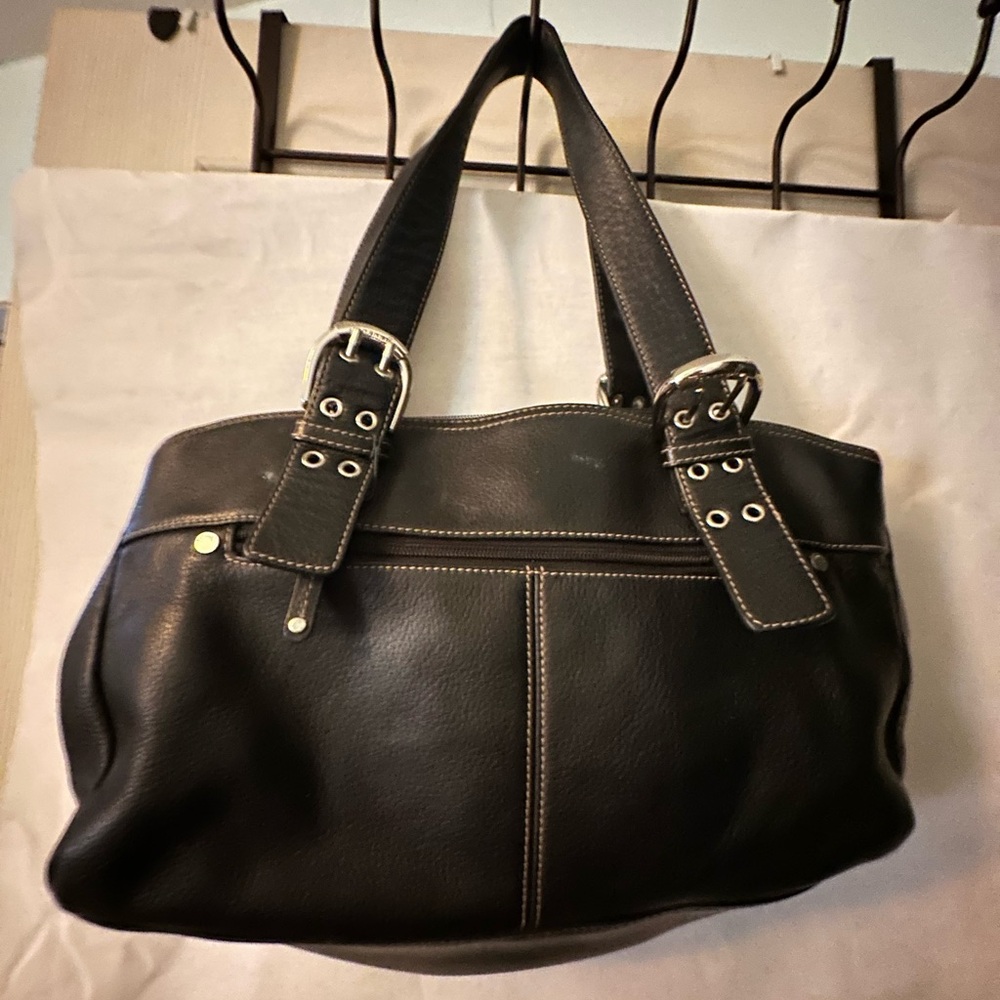 Woman’s purse with three pockets inside and a couple of little ones gently used